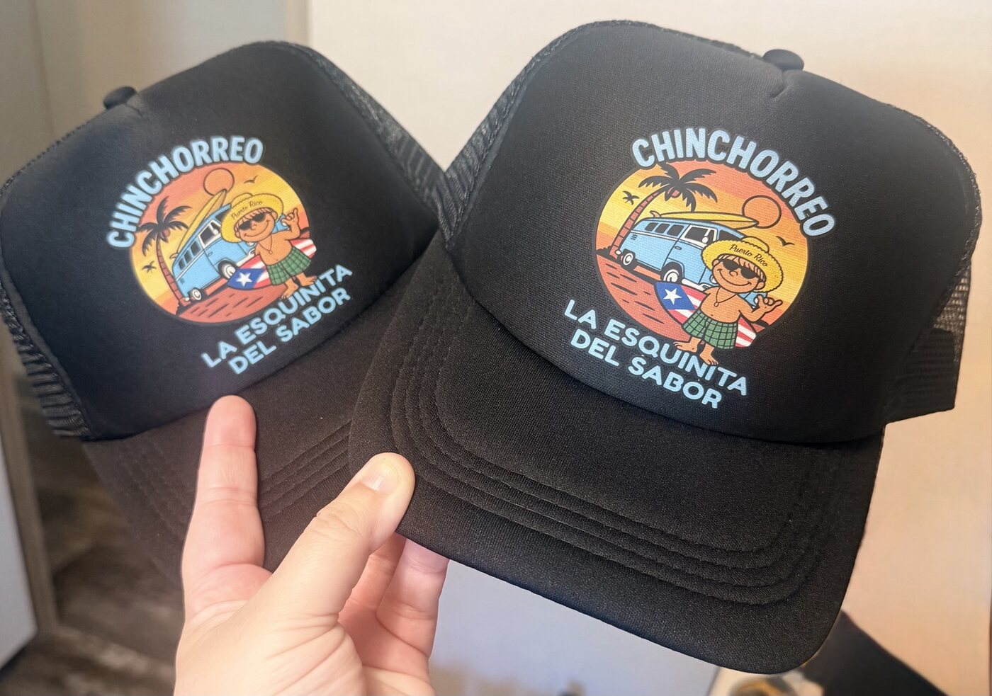 Two custom black trucker hats for Chinchorreo La Esquinita del Sabor