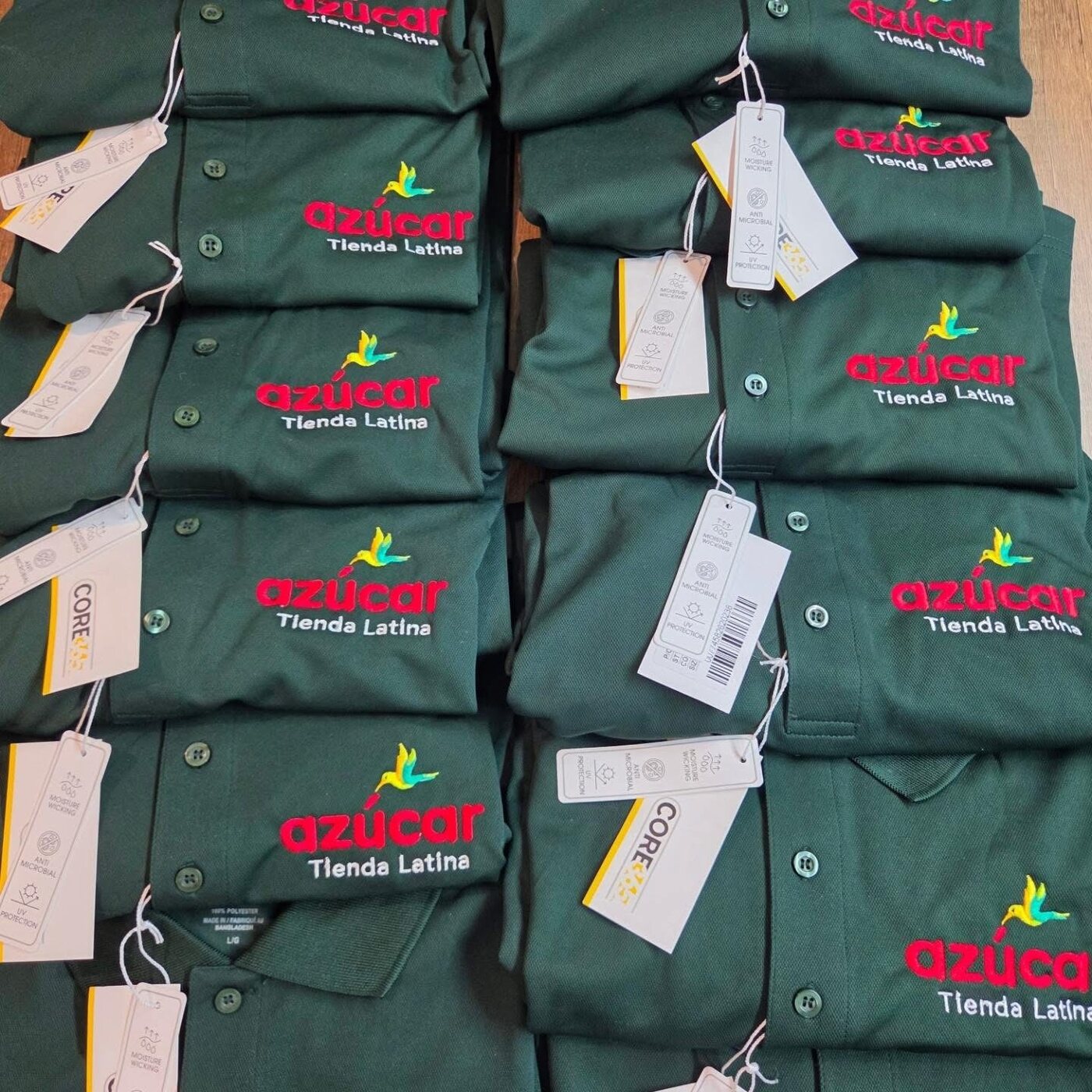 Dark green embroidered polo shirts for Azúcar Tienda Latina